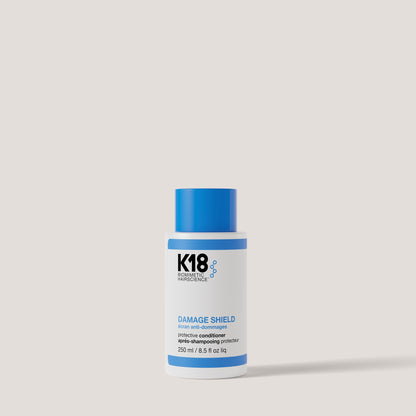 K18 Damage Shield Protective Conditioner 250ml on grey background