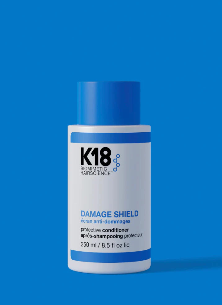 K18 Damage Shield Protective Conditioner 250ml on grey background